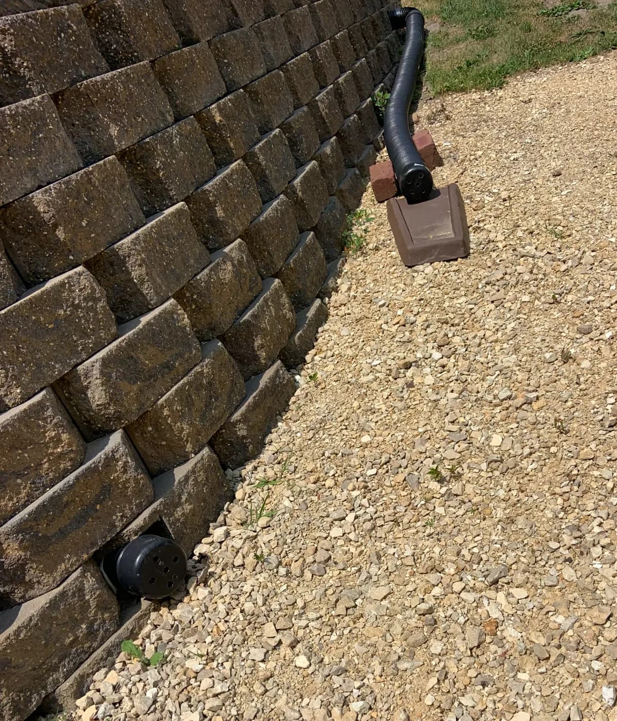 Gravel-filled French drain trench