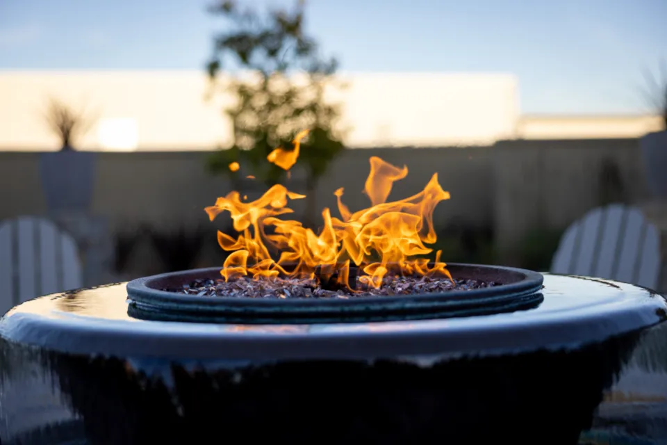 Stone fire pit area on a paver patio